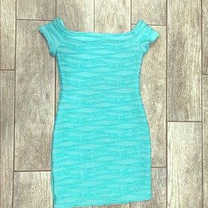 Bright turquoise form fitting dress